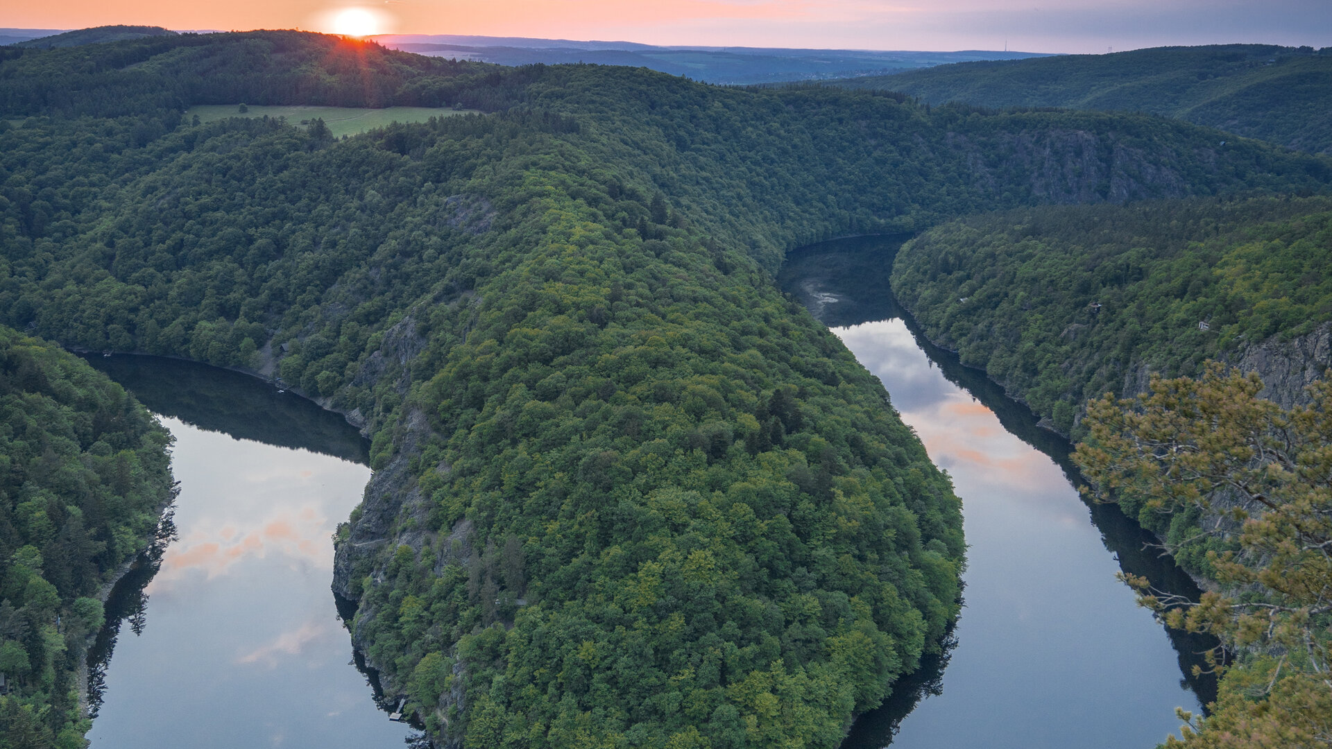 Traveler standing at Viewpoint Máj overlooking the Vltava river bend